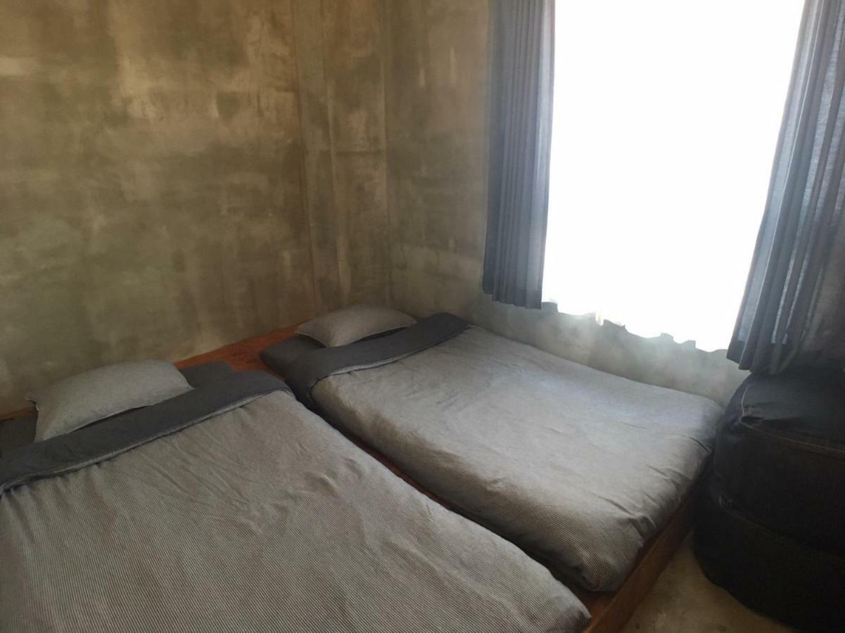 Guest House Golden Mile Hostel Amami Bagian luar foto