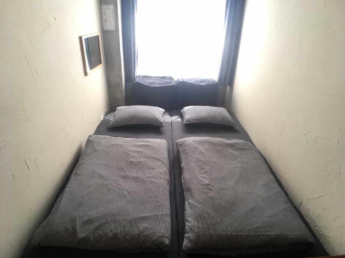 Guest House Golden Mile Hostel Amami Ruang foto