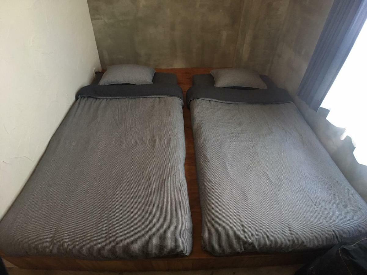 Guest House Golden Mile Hostel Amami Bagian luar foto