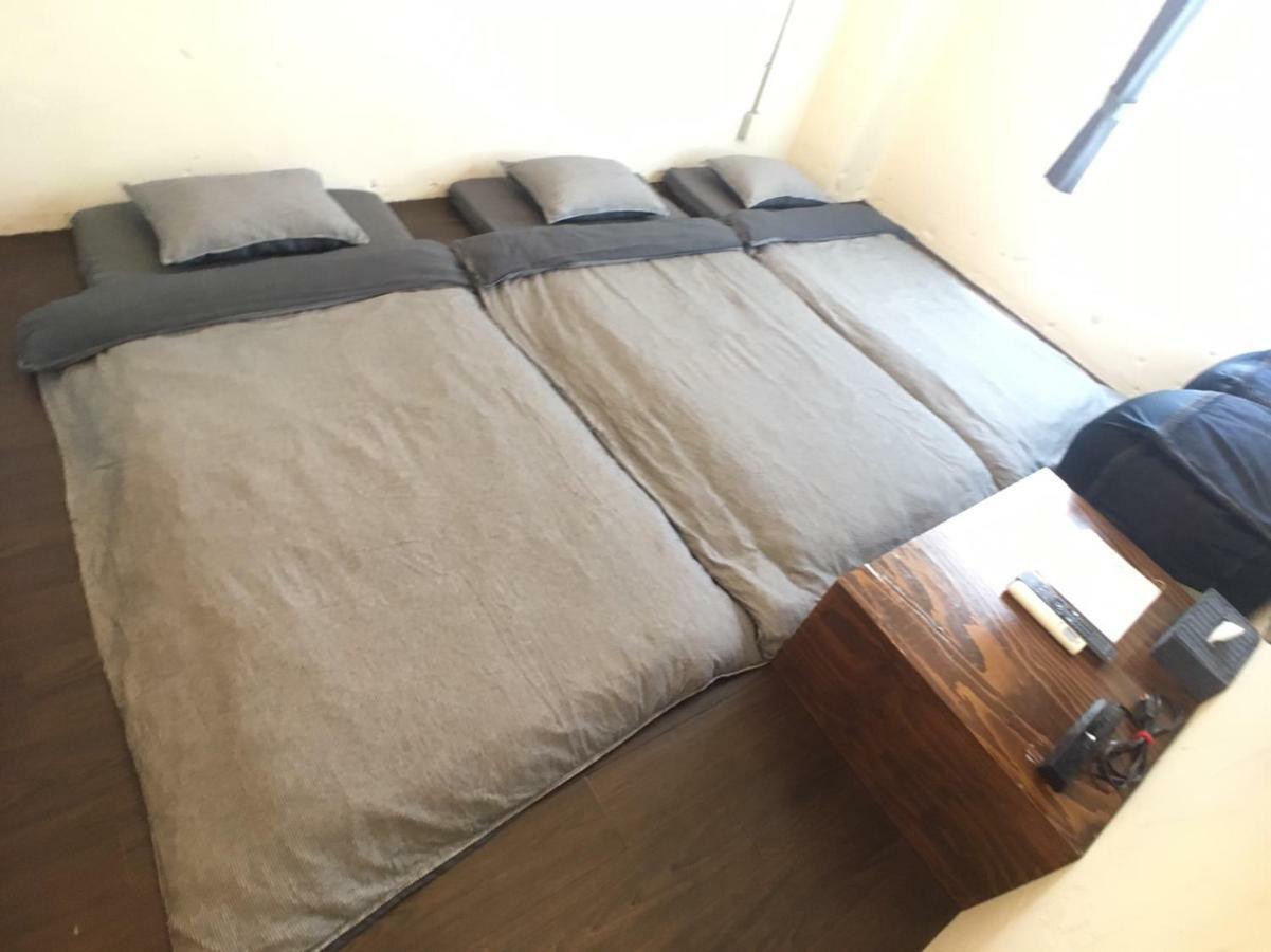 Guest House Golden Mile Hostel Amami Bagian luar foto