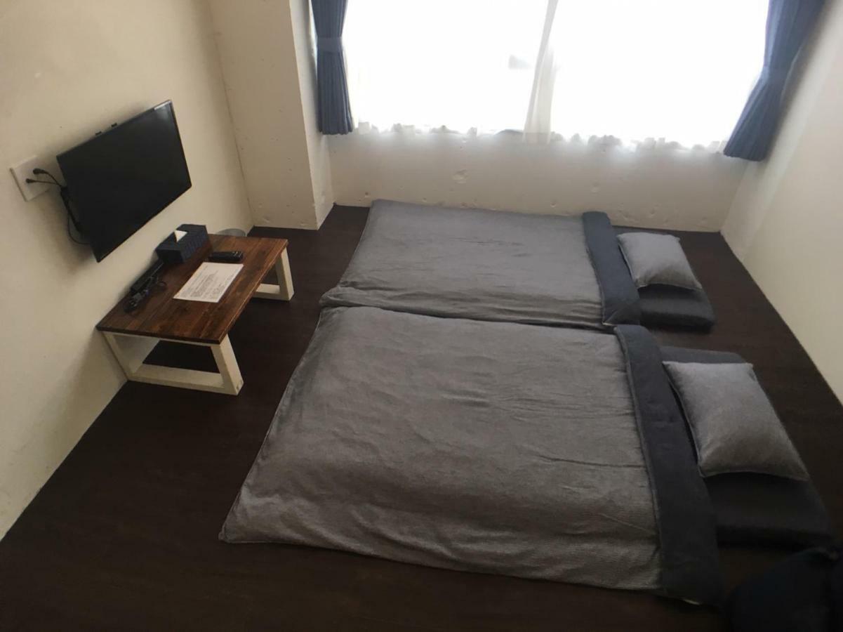 Guest House Golden Mile Hostel Amami Bagian luar foto