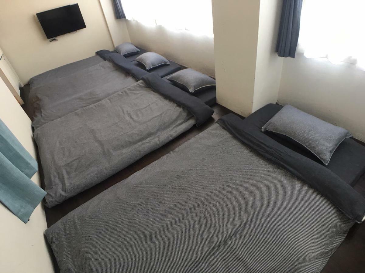 Guest House Golden Mile Hostel Amami Bagian luar foto